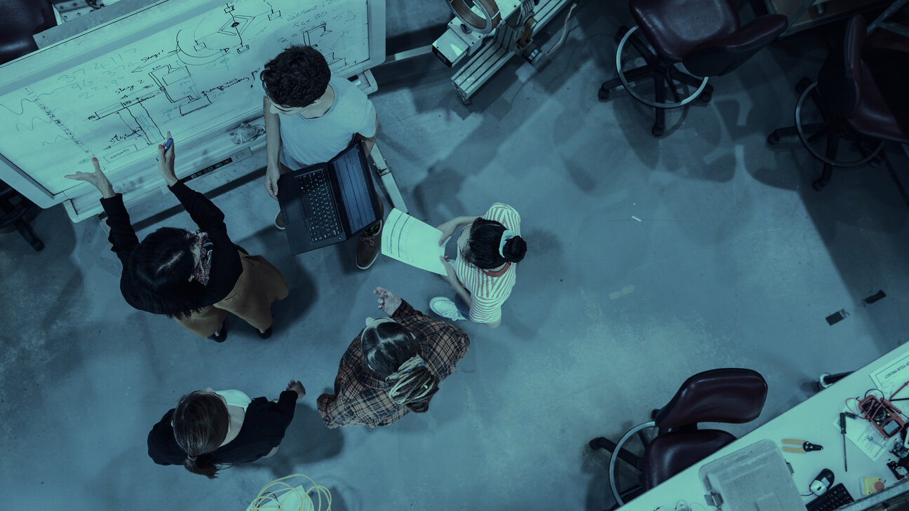 Planning office with five planners from above